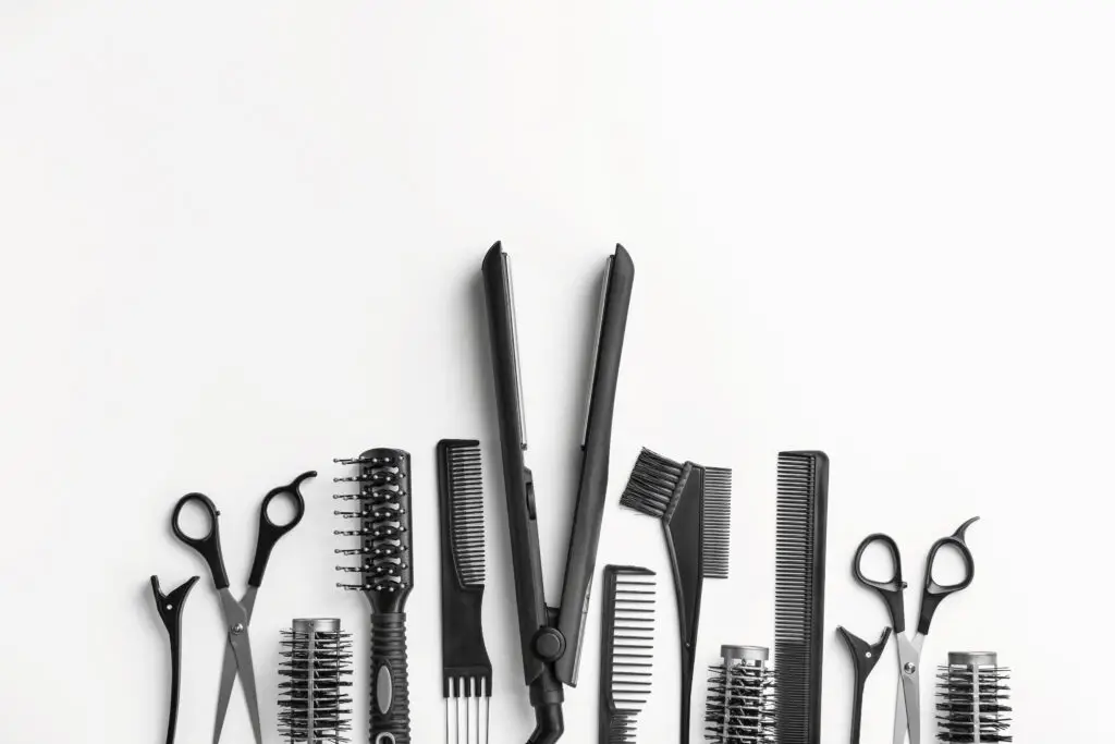 Set of hairdresser tools and accessories on white background